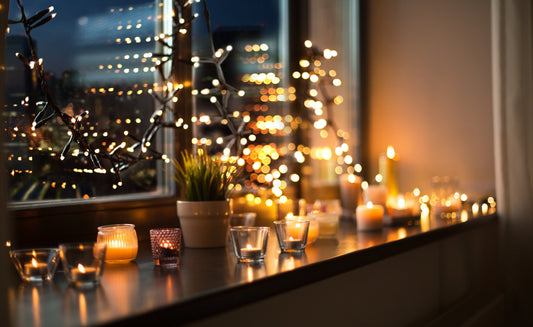 Cosy hygge candles and festive garland at home