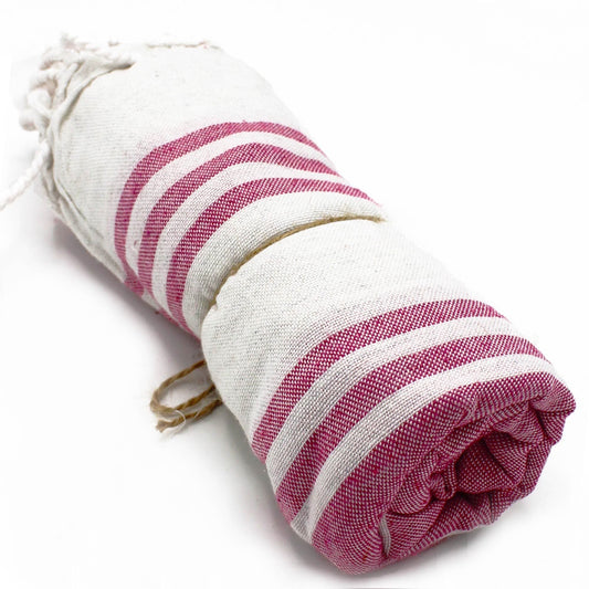Spa towel folded on a bathroom shelf